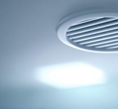 Clean modern interior ceiling with white ventilation vent or air diffuser. simple system for climate control creating calm and cool atmosphere in room Clean modern interior ceiling with white ventilation vent or air diffuser. simple system for climate control creating calm and cool atmosphere in room